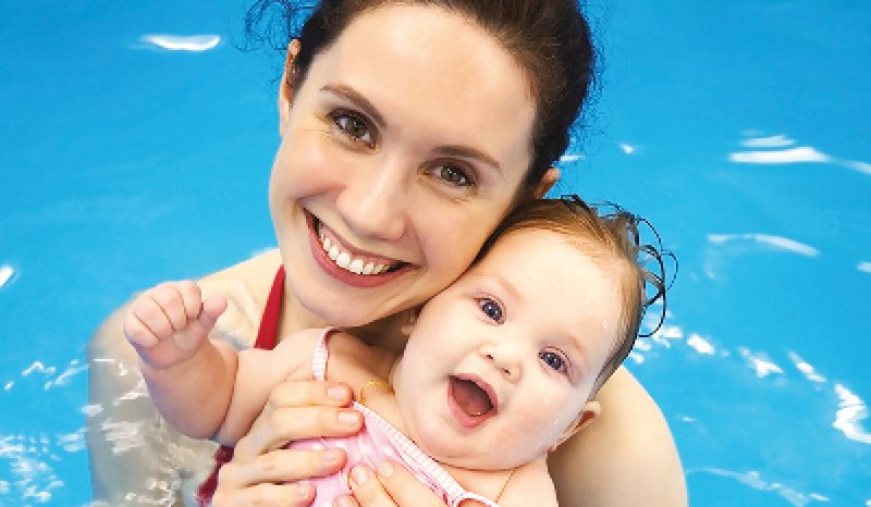 Mother and child swimming lessons